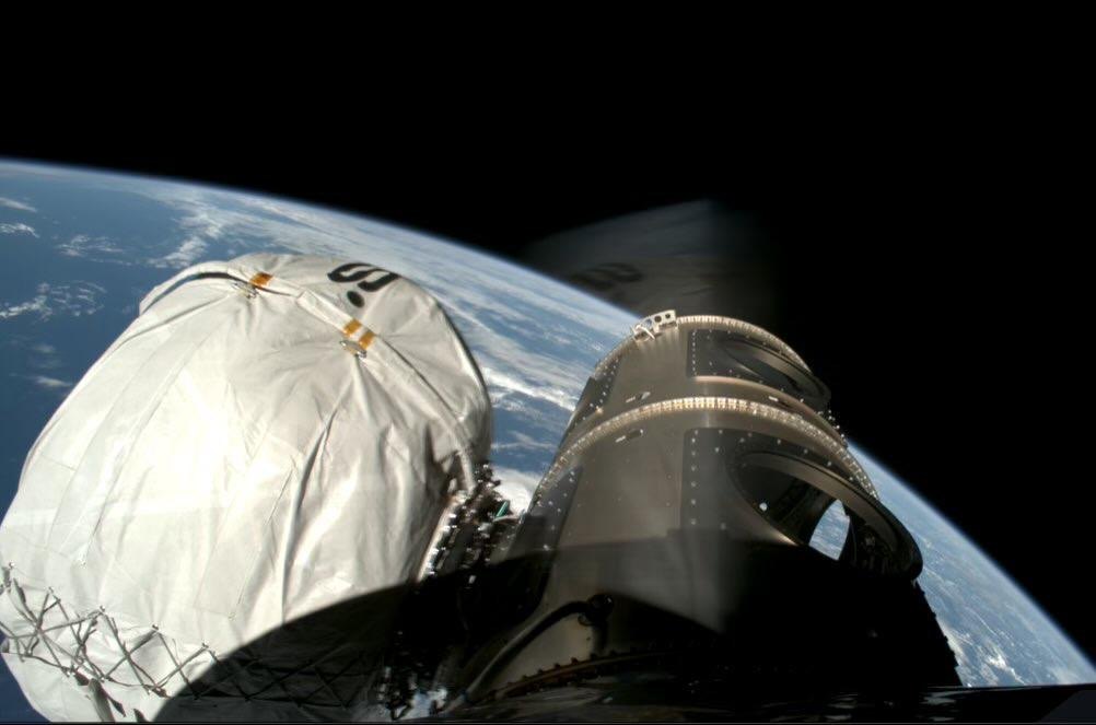 Cosmic Kiss payload in space, Earth below